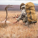 DIY hunter admiring his caribou.
