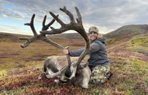 A woman hunter with a giant velvet bull